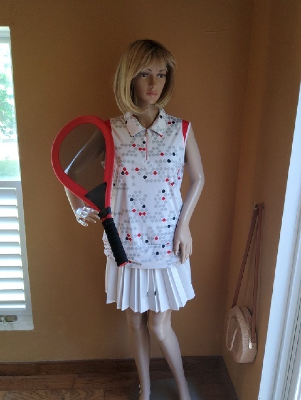 NVO Sleeveless Zip Golf Polo in White with Red, Gray & Black Dot Print